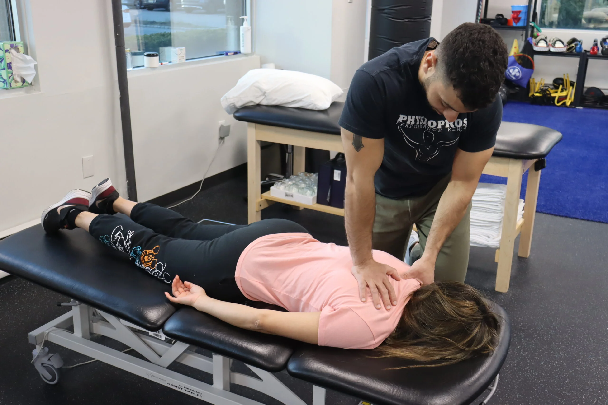 PT performing Trigger Point Release on upper back