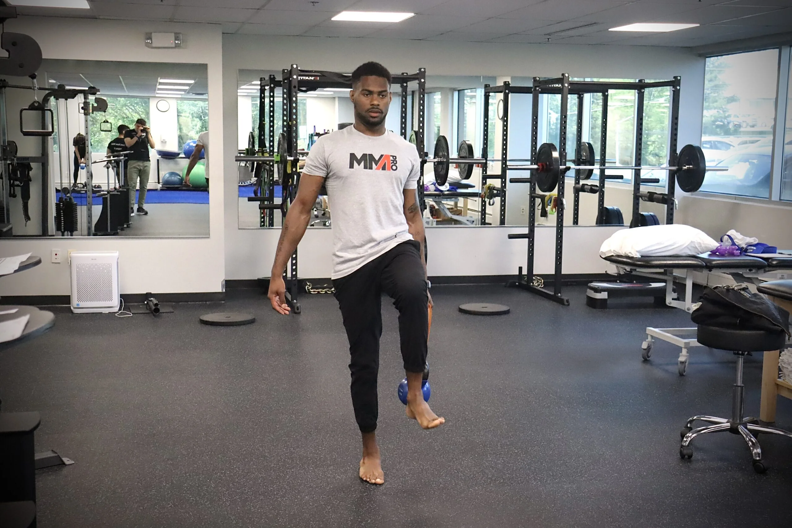 Patient performing KB marches