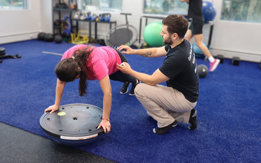 PT demonstrating correct plank form