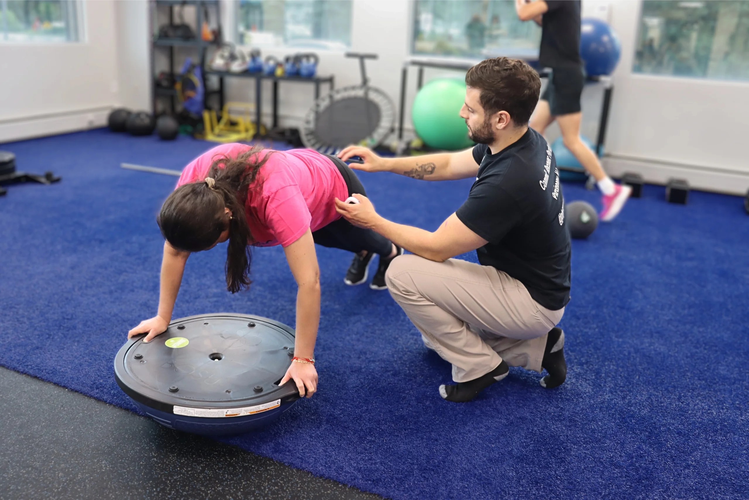 PT demonstrating correct plank form